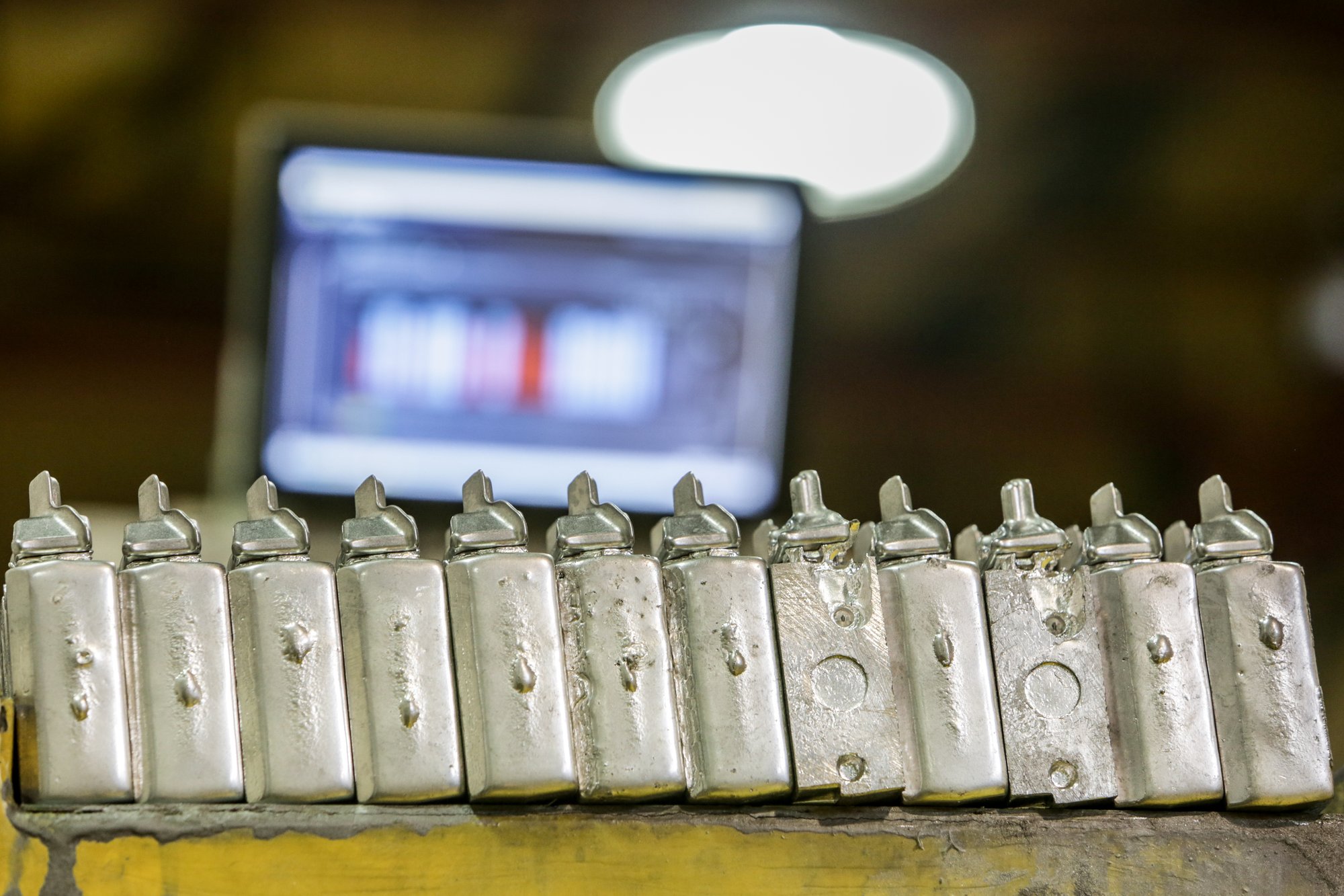 Machined parts lined up on the shop floor